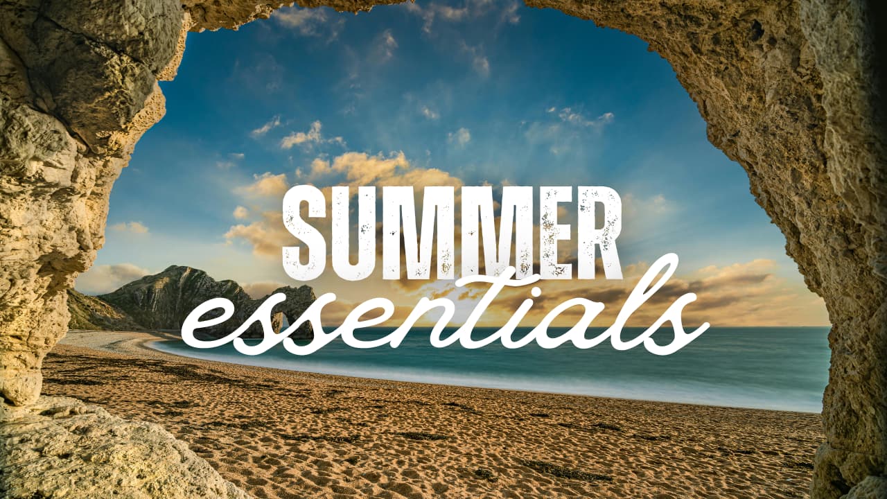 A picturesque beach behind the text "summer essentials"